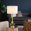 Front view of the 29-inch multicolor glass drum table lamp in a vibrant living room