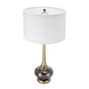 Multicolor glass lamp casting warm, inviting ambient light over a cozy seating area