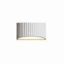Vintage plaster wall lamp providing gentle, glare-free night lighting for a master suite