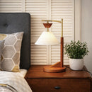 Close-up detail of the brown solid wood base and natural cone linen shade