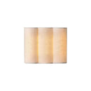 Close-up detail of the smooth curved fabric shade and warm interior LED glow