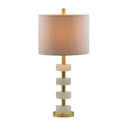 Elegant white marble table lamp illuminating a luxury master bedroom nightstand