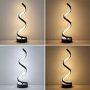 Artistic black and white curved design of the spiral LED table lamp in a minimalist living room