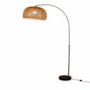 Ambient living room lighting provided by the tall architectural arc fixture