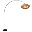 Elegant arc floor lamp gracefully curved over a modern sectional sofa