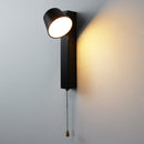 Sleek black and white wall lamp illuminating a contemporary residential corridor