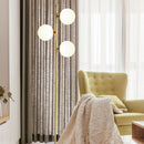 Angled view showcasing the gold aluminum frame and glass shade of the LED floor lamp