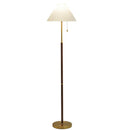 Elegant vertical standing lamp positioned next to a comfortable fabric sofa