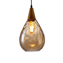 Elegant glass pendant light suspended stylishly over a contemporary home bar counter