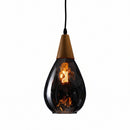 Amber glass variation of the Nordic chandelier casting a warm, inviting glow in a cozy living space