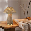 Cordless LED desk lamp illuminating a cozy outdoor patio dining table at night
