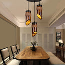 Front view of a retro American country wooden small chandelier in a rustic dining room
