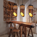 Single-head wooden small chandelier hanging elegantly over a vintage farmhouse kitchen island