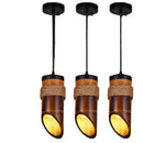 Warm illumination radiating from the retro American country chandelier in a cozy cabin bedroom