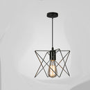 Small iron cage chandelier suspended elegantly over a rustic wooden dining table