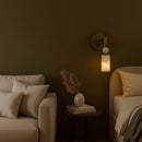 Close-up detail of the natural marble shade showing unique veining and warm LED glow