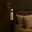 Angled perspective showcasing the rich vintage brown copper finish of the wall fixture