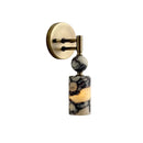 Vintage-style wall sconce providing sophisticated accent lighting for a luxury hotel suite