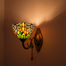 Elegant stained glass wall lamp illuminating a vintage-inspired hallway corridor