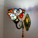 Close-up detail of the multicolored stained glass shade and sparkling European crystal drops