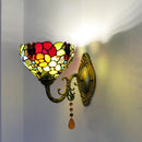 Angled perspective showcasing the ornate antique bronze mounting arm and 20cm shade